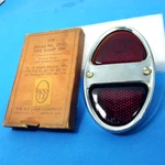 Nos 1931-1932 Chevy Tail Light Lens +bezel Do-ray Tiger Eye Kd 221-D. Fixed Price $40.00.