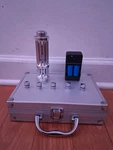 Chargable Battery Powered Powerful Laser Pointer With Case And Design Caps. Fixed Price $120.00.