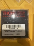 Thorlabs A230TM-B F = 4.51 Mm, Na 0.55, Wd 2.53 Arc: 650 1050 Nm. Fixed Price $90.00.