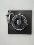 135MM F/4.7 Raptar W/wollensak Rapax Synchromatic Read. Fixed Price $70.00.